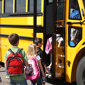 Students getting on the school bus