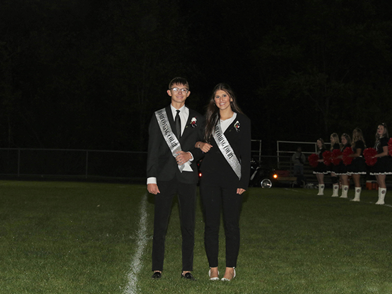 Homecoming couple on the football field