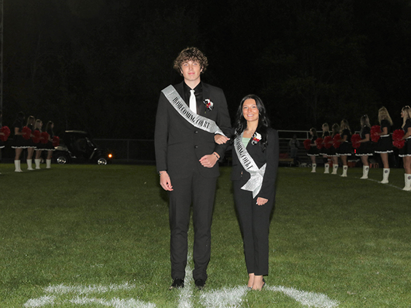 Homecoming court couple on the field