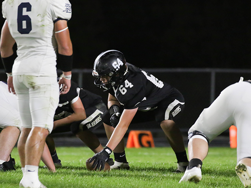 Football player starting a play