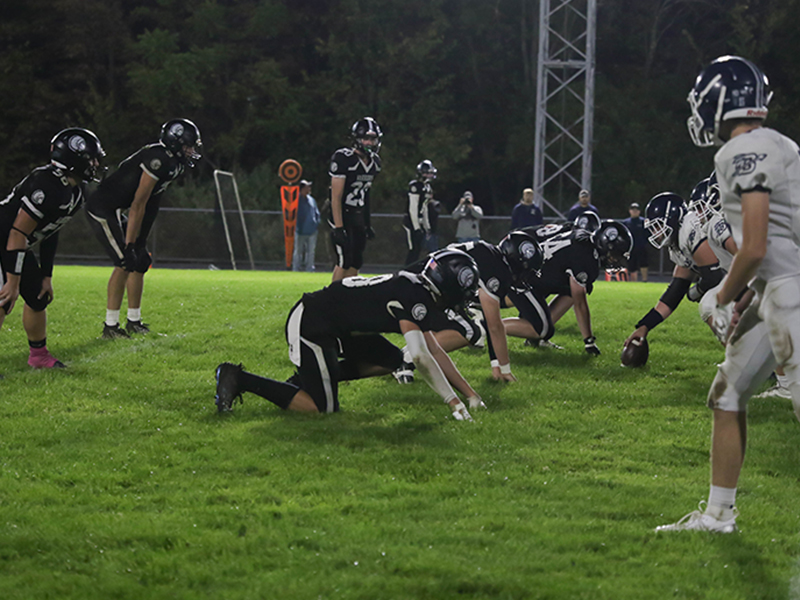 Football players preparing for a play