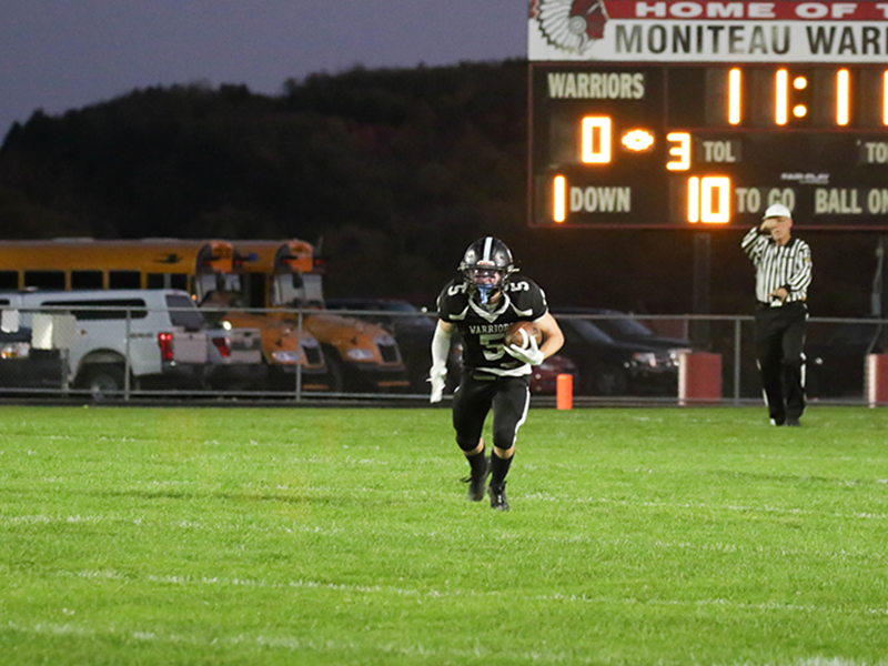 Football player running with ball