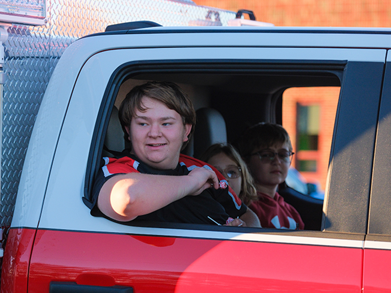 Students in a red truck
