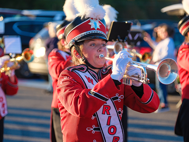 Band member blowing horn