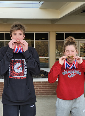 Boy and girl swim medalists
