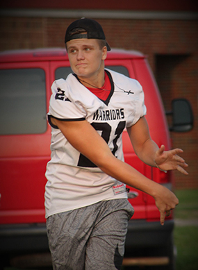 boy playing football